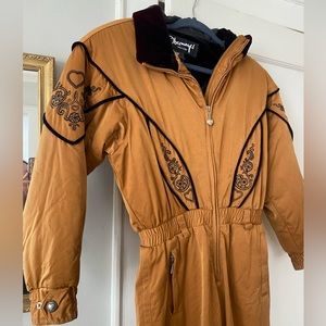 Vintage woman’s obermeyer ski suit size 8 petite brown with black detailing.